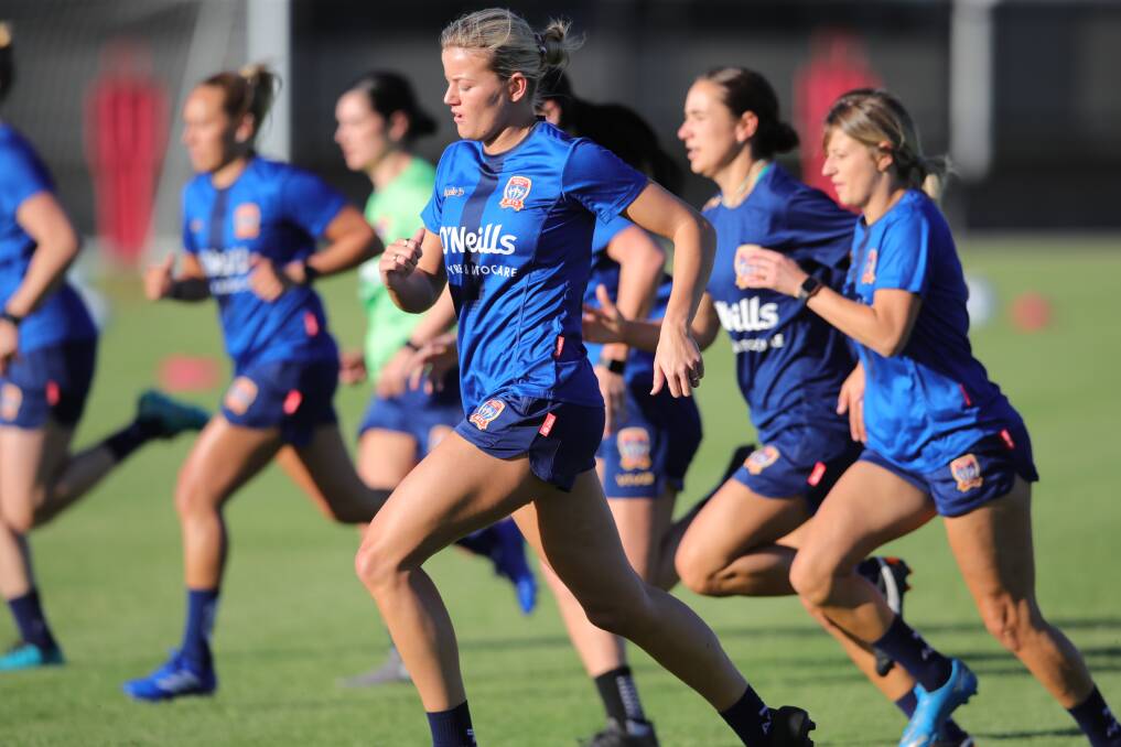 BACK IN ACTION: Jets striker Sophie Harding stretches out at Newcastle's first training session of the 2021-22 A-League Women's season at Speers Point on Monday. Picture: Newcastle Jets
