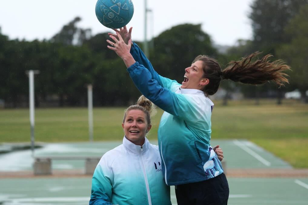 Norths championship coach Rian Hodges, left, and player Karlie Quinn at Newcastle netball courts last week. Picture by Peter Lorimer