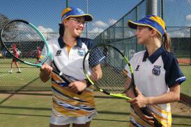 Hunter PSSA tennis captain Neive Pung, left, with teammate Estella Murray at the NSW titles at Broadmeadow on Wednesday. Picture by Simone De Peak
