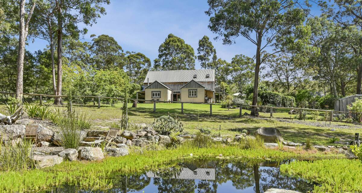 PICTURE PERFECT: This colonial style mudbrick home is positioned on a 71-acre "eco-friendly" property at Congewai and has a guide of $1 million to $1.1 million.