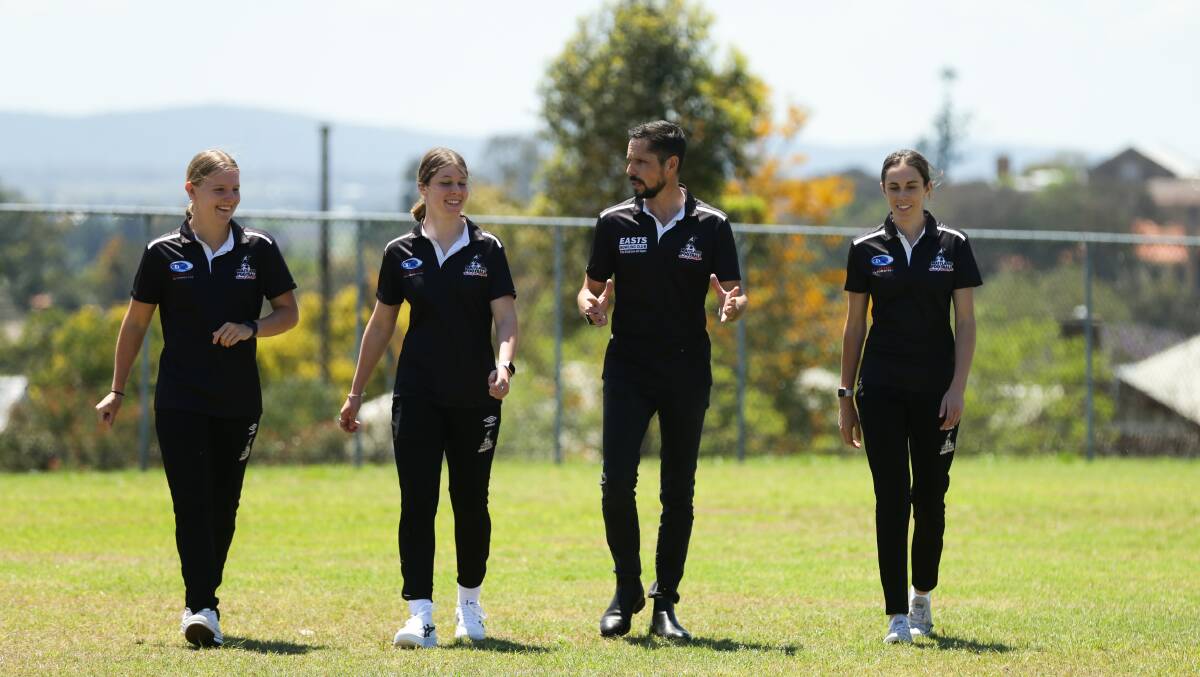 NEW MOVE: David Walker, pictured with Maitland players Bronte Peel, Mercedes McNabb and Madi Gallegos, will coach the Magpies in 2022. Picture: Jonathan Carroll