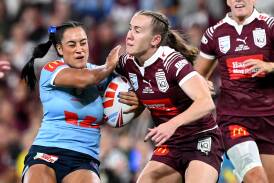 NSW back-rower Yasmin Clydsdale runs into Queensland fullback Tamika Upton in Origin I. Picture Getty Images