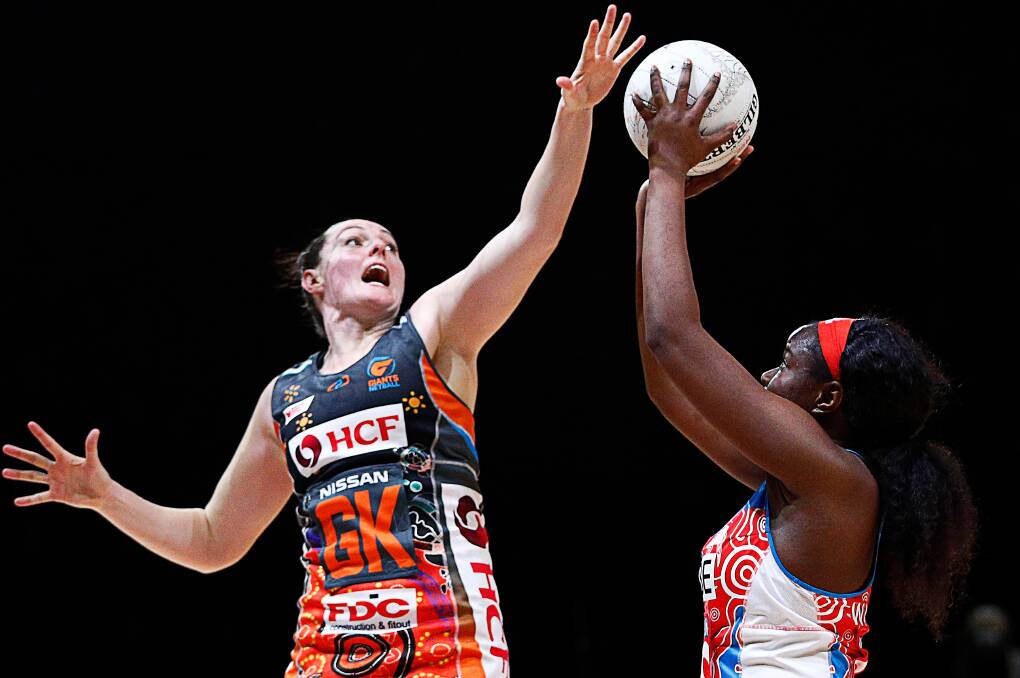 MOTIVATED: Newcastle's Sam Poolman, left, in action during the Super Netball this season. She is determined to put out a strong performance this weekend to help GWS Giants secure the minor premiership and a home semi-final. Picture: AAP Images