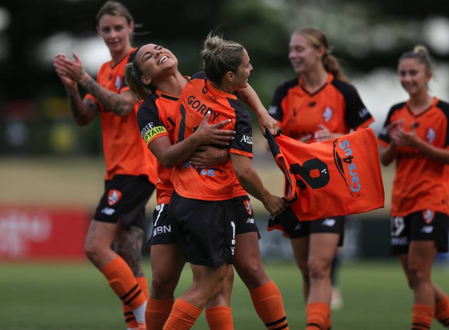 Brisbane Roar celebrate the first of Katrina Gorry's match brace against Newcastle at No.2 Sportsground on Friday night. Picture by Marina Neil