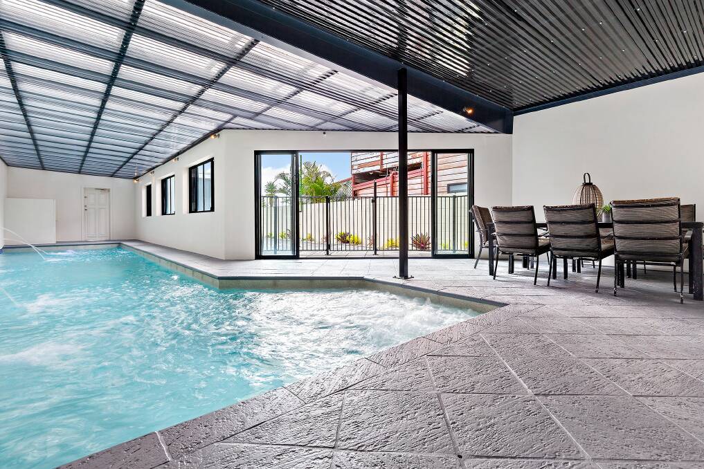  This property in Redhead's Beach Road featured two homes separated by an indoor swimming pool.