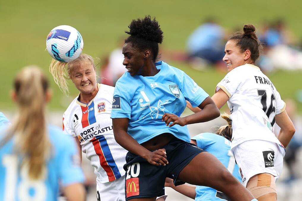 TESTING: Tara Andrews heads the ball under pressure from Sydney's Princess Ibini at Netstrata Jubilee Stadium on Saturday. Picture: Getty Images