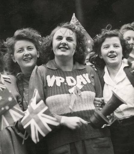 Rejoicing VP Day on August 15, 1945. Lois Anne Martin knitted a
red, white and blue vest especially for VP Day and never wore it again.
The vest is on display in the Australian War Memorial's Second World War Gallery. Picture: Australian War Memorial 