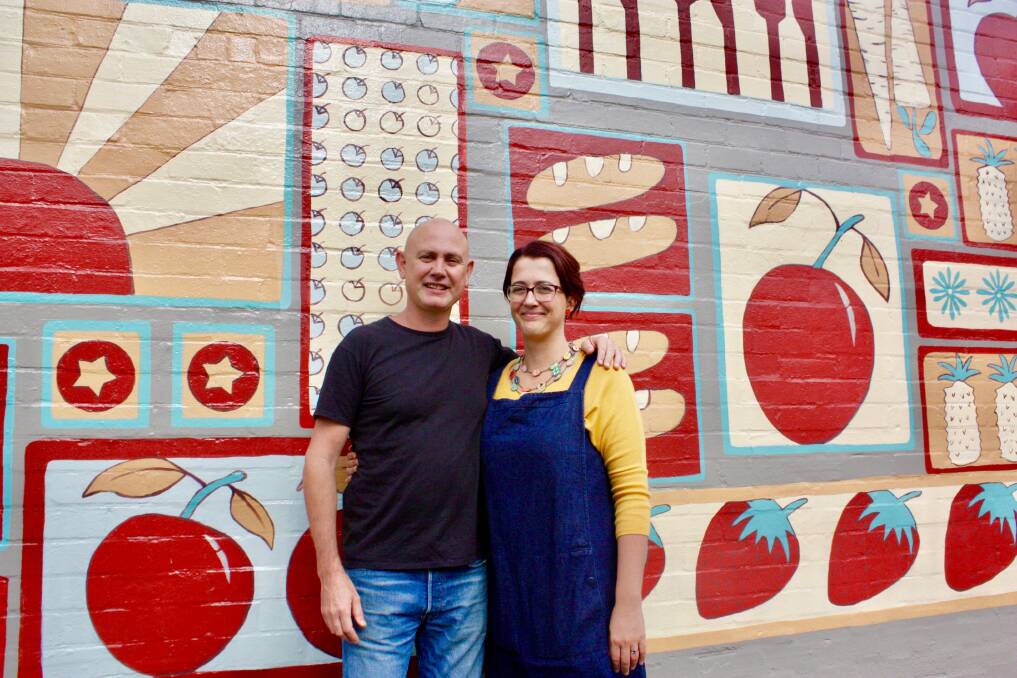 Dedicated: Owners, Andy and Anna Ward in front of the eye catching mural outside their organic store, Goodness Me Organics in Adamstown.
