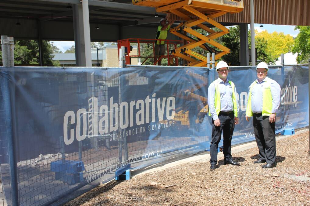 Todd Bacon and Andrew Fisher stand in front of the new CORA nearing completion at the University of Newcastle Ourimbah campus.