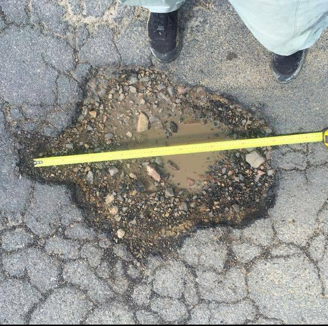 Rough road: The pothole that allegedly damaged Rebecca Potter's car. Picture: Supplied
