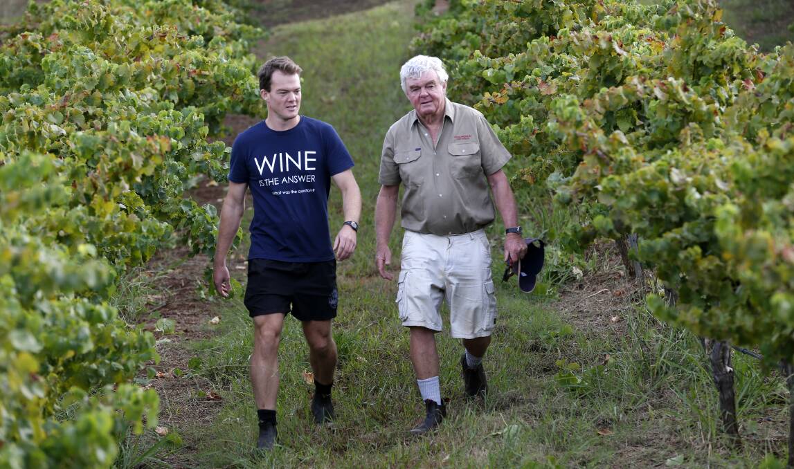 LEGACY: John Davis (right) and his son Tim inspect the showcase Tallavera Grove vineyard at Mount View. Tim is owner and vigneron of the Carillion operation, while Jaclyn Davis is owner and general manager of Briar Ridge.