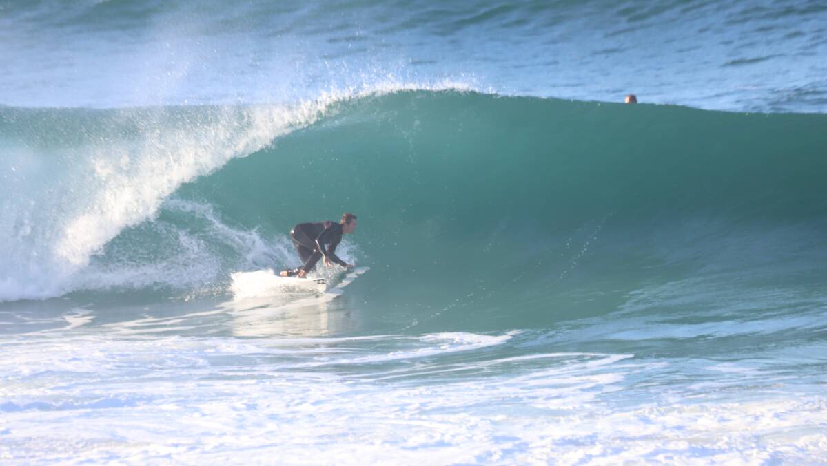 BREAK: A surfer at Merewether on Wednesday. Picture: Dave Anderson 