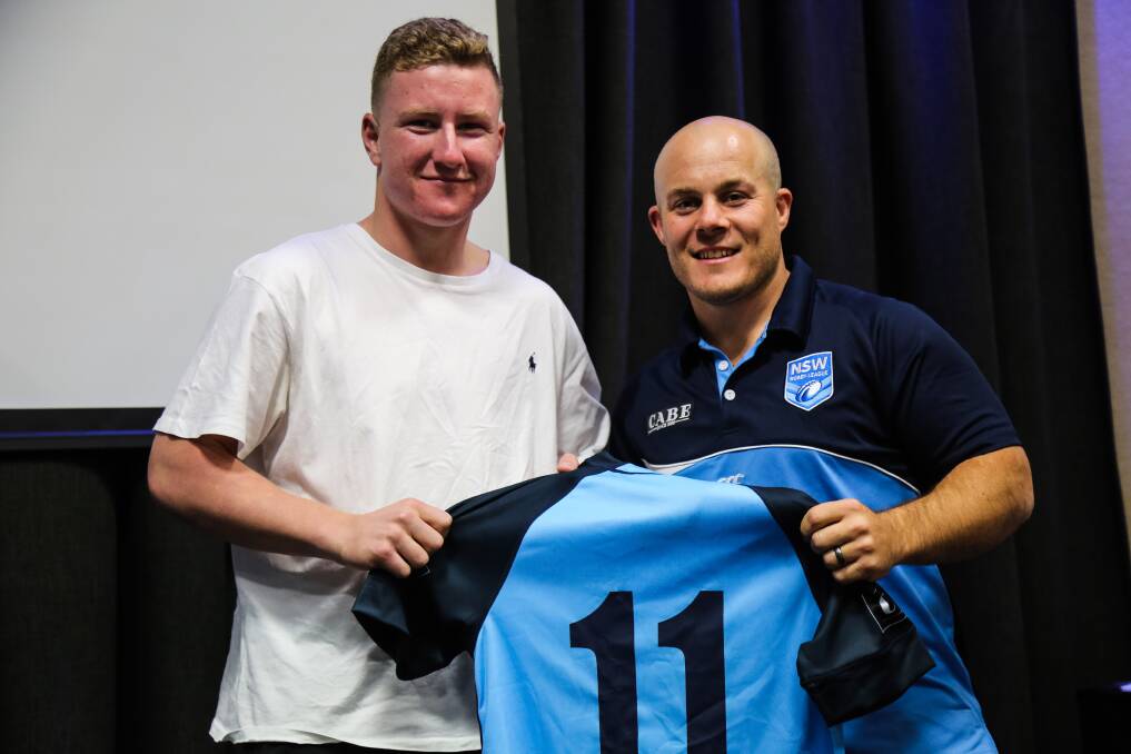 EXPERIENCE: Thomas Cant accepts his match jersey ahead of the match. 