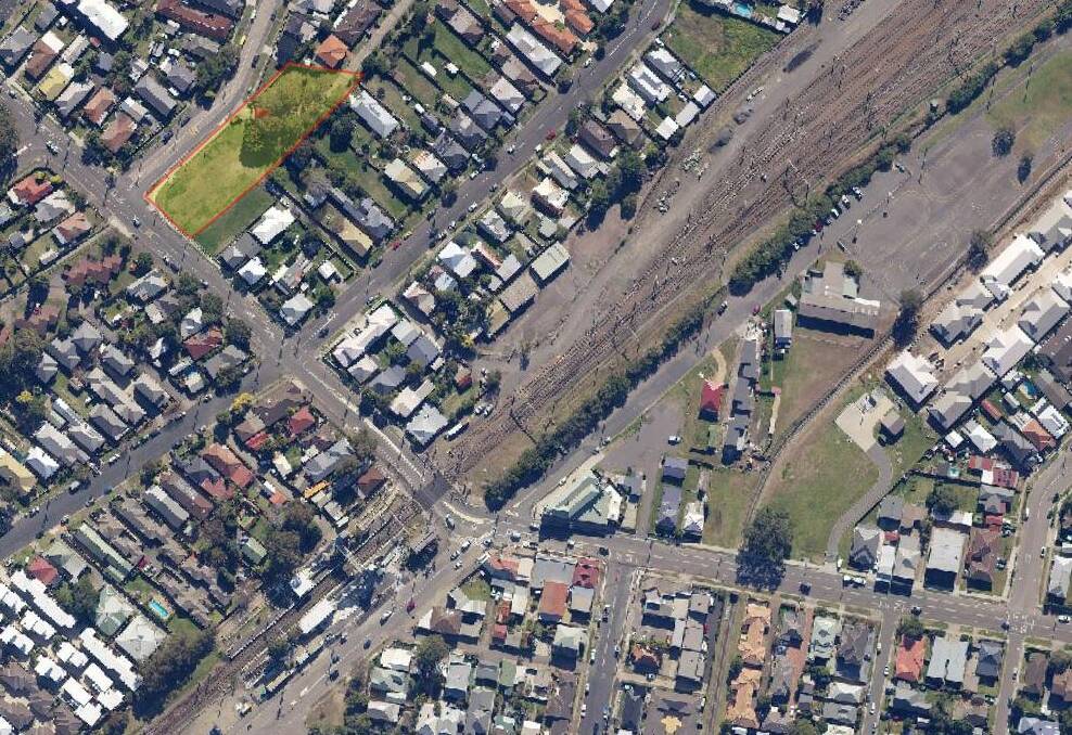 FINAL SALE: A satellite image of the Adamstown railway crossing and the property Transport for NSW intends to auction, 64 Mackie Avenue (highlighted yellow). It once formed part of a plan for a bridge over the rail line. 
