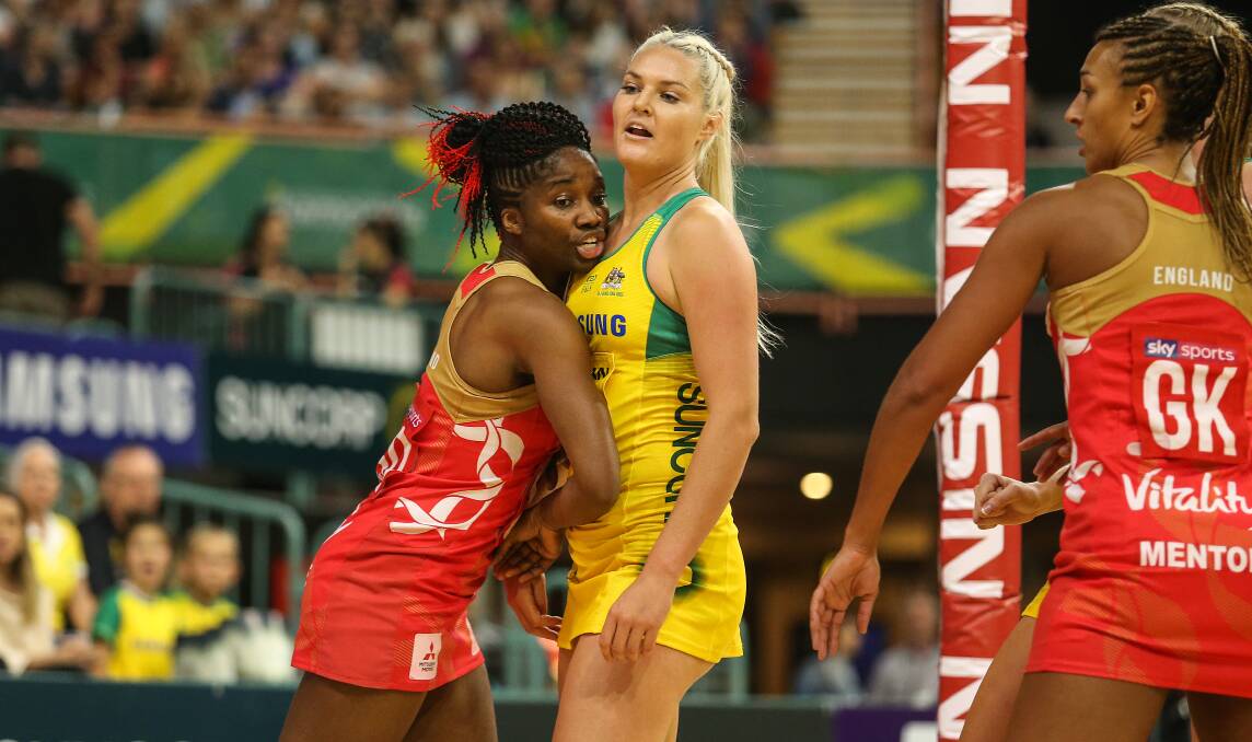 TEST: Australia's Gretel Tippett and England's Ama Agbeze playing in Newcastle in 2018. Picture: Marina Neil