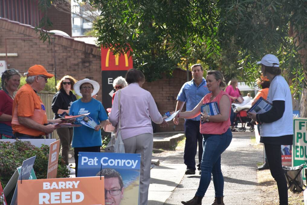 EARLY VOTE: Volunteers and voters out the front of the pre-poll voting centre at Charlestown on Friday. Picture: Max McKinney 