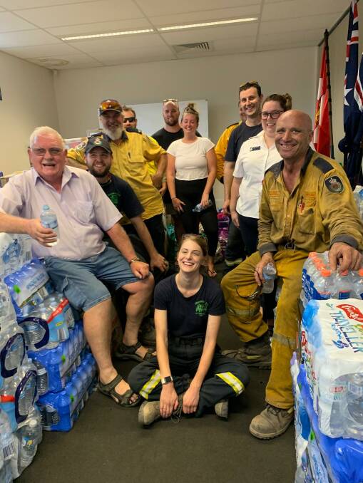 APPRECIATIVE: Staff and volunteers at the Hunter Valley Fire Control Centre in Bulga after unloading the donated goods. 