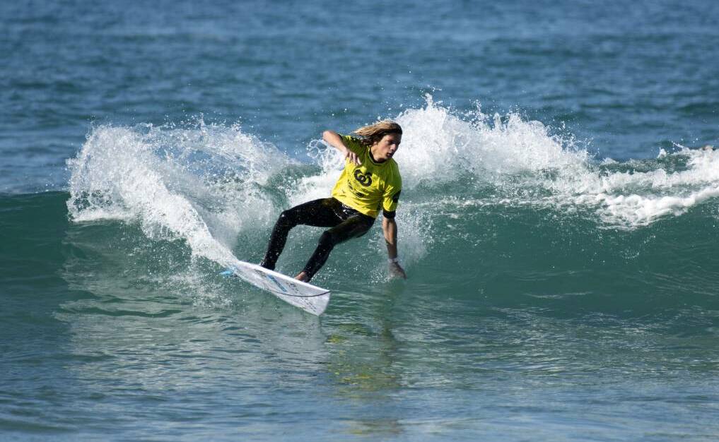 SMOOTH: Mike Clatyon-Brown surfs a wave in Coffs Harbour earlier this year. 
