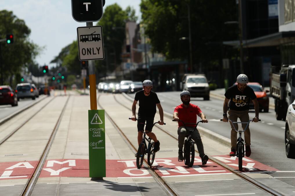 WRONG PATH: BMX riders stopped on the light rail line in Hunter Street. A arange of safety issues have been identified in recent months. Picture: Jonathan Carroll