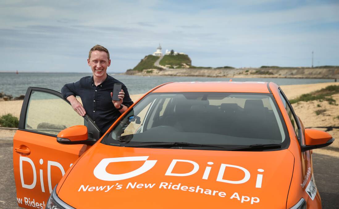 FRESH RIDE: DiDi spokesman Douglas Toy with a DiDi Express promotional vehicle in Newcastle last week. The company aims to provide affordable, convenient and safe on-demand mobility options. Picture: Marina Neil