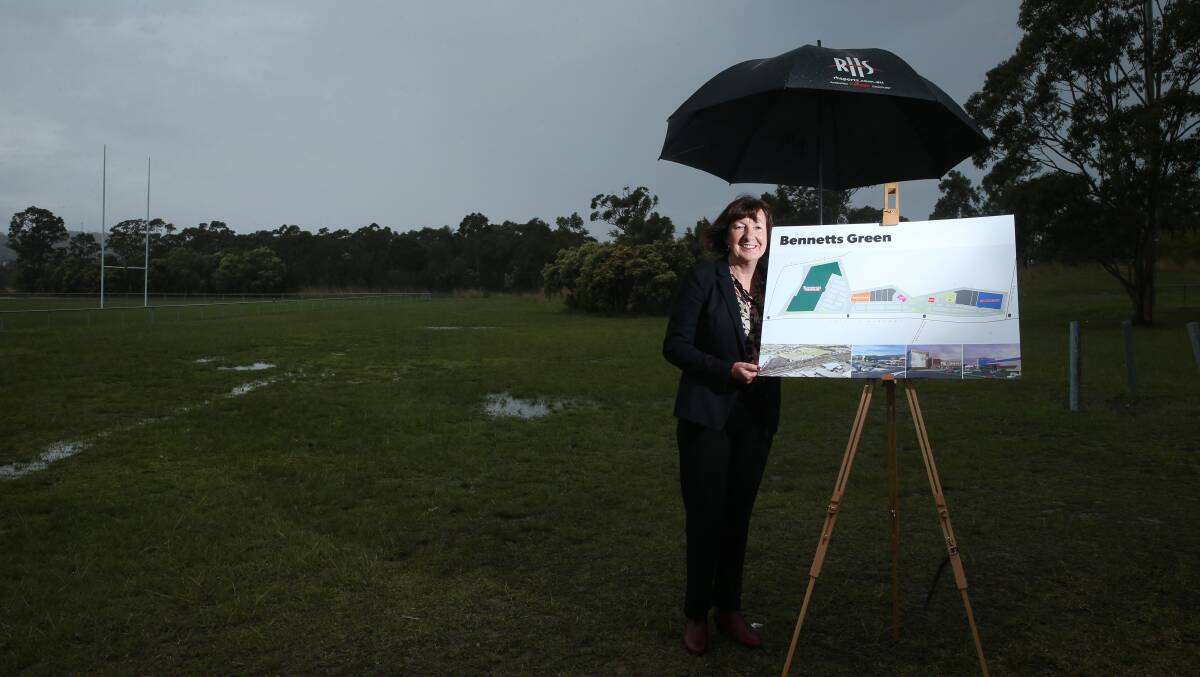 Lake Macquarie mayor Kay Fraser with plans for the retail centre development at Bennetts Green. Picture: Marina Neil