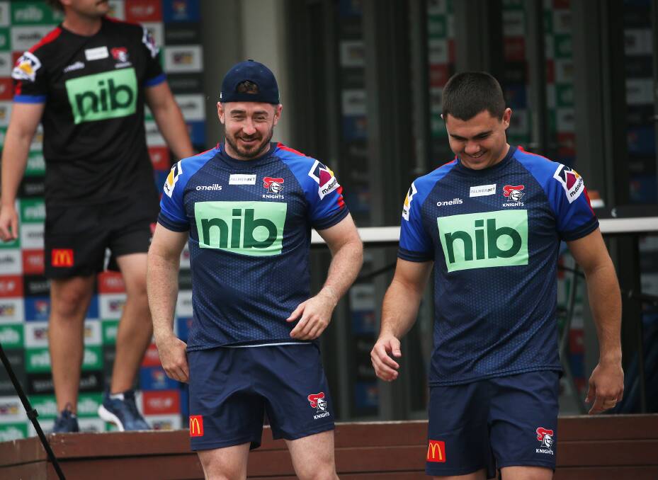 Adam Clune with Jake Clifford at Knights training. Picture: Peter Lorimer. 