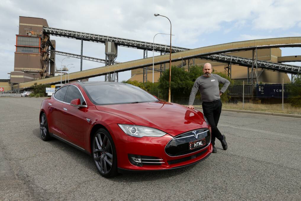 LEAP OF FAITH: Michael Barwell with his Tesla model S. Picture: Jonathan Carroll