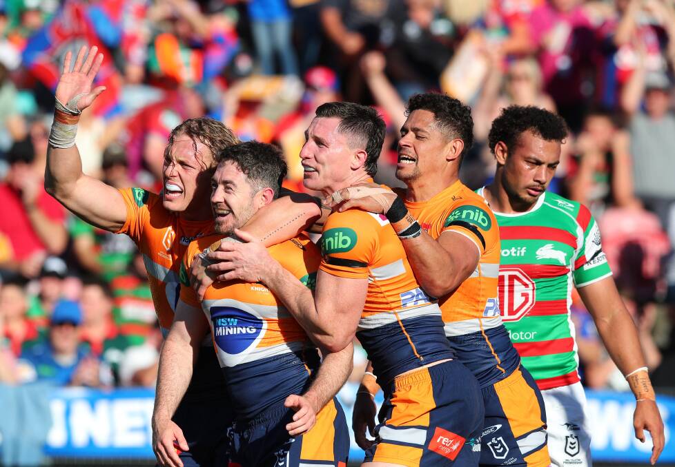 Adam Clune, centre, celebrates a try against South Sydney in round 25. Picture by Peter Lorimer 