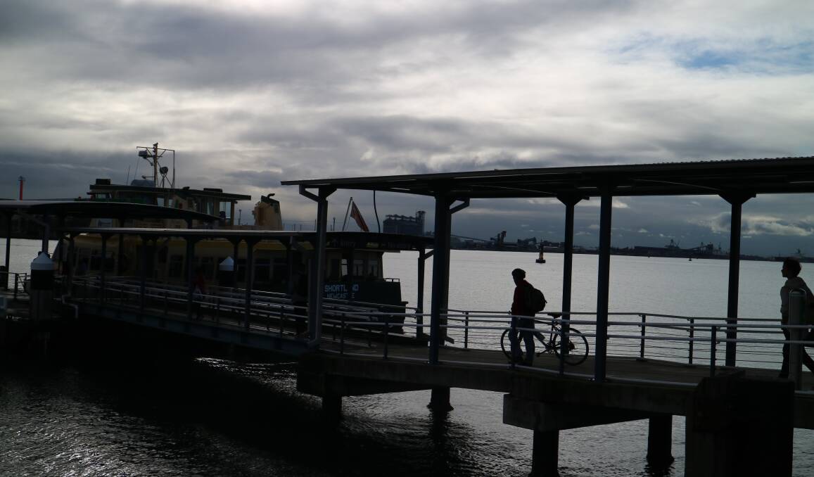 NOT MANY ON BOARD: A cyclist waits to board the Newcastle-Stockton ferry at Queens Wharf on Friday afternoon. Picture: Jonathan Carroll