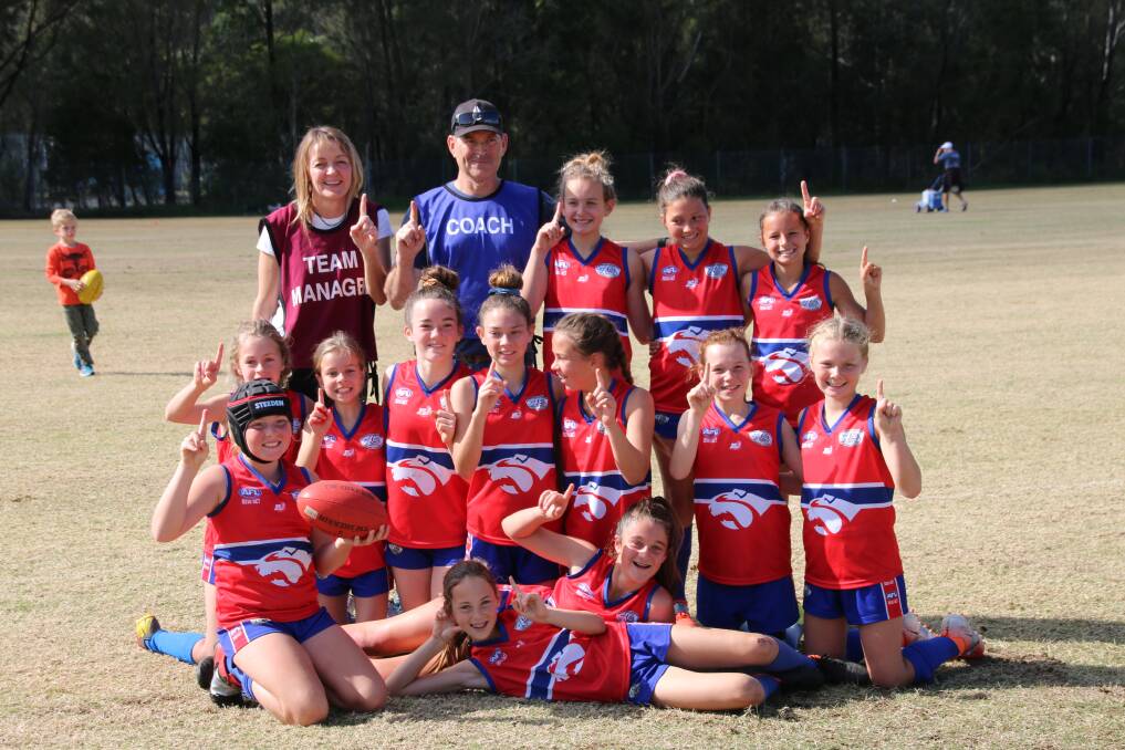 WINNERS: The Warners Bay Bulldogs under-12 girls after their grand final. 