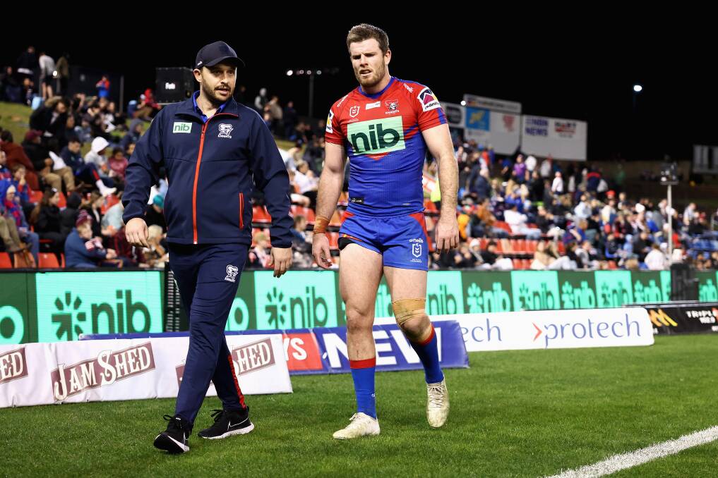 DOWN AND OUT: Knights back-rower Lachlan Fitzgibbon leaves the field at McDonald Jones Stadium on Friday night. Picture: Getty Images