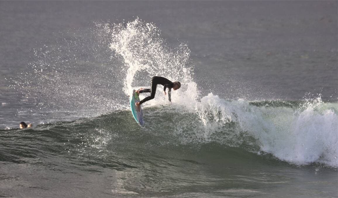 GROM: Felix Byrnes in the surf on Wednesday. Picture: Dave Anderson