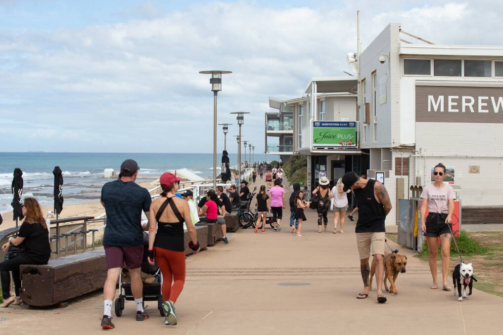 TOO CLOSE: People on the foreshore at Merewether beach on Sunday morning. Picture: Max Mason-Hubers