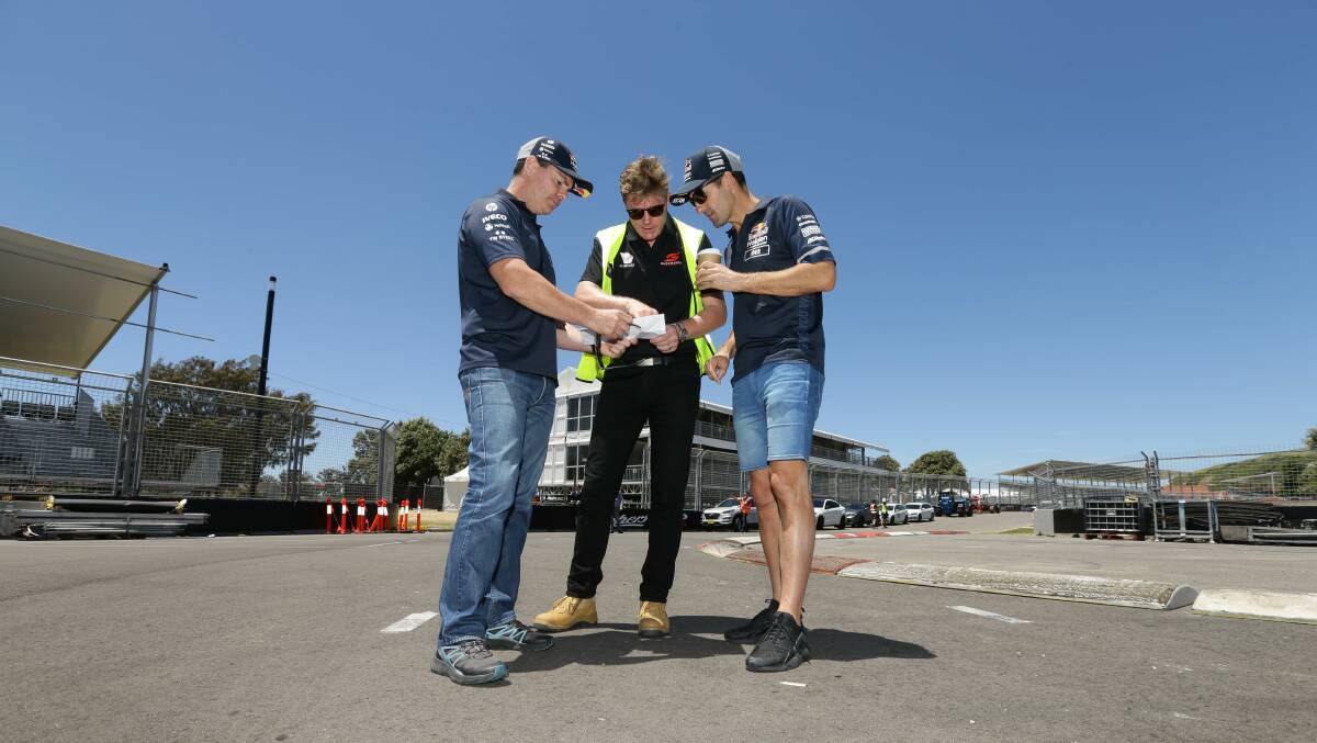 CHECK: Supercars legend Craig Lowndes with event manager Kurt Sakzewski and Jamie Whincup at the hairpin last Friday. Picture: Jonathan Carroll