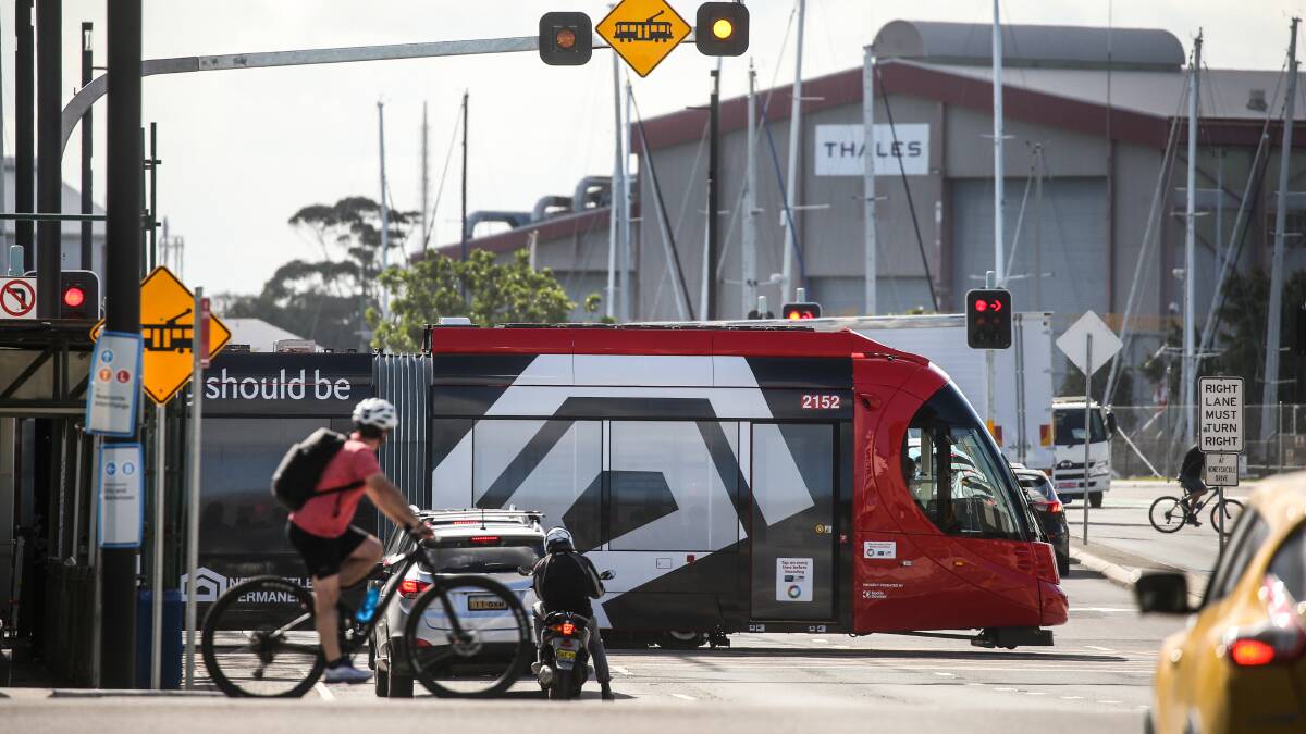 TRANSPORT: A cyclist and tram cross Stewart Avenue. Picture: Marina Neil
