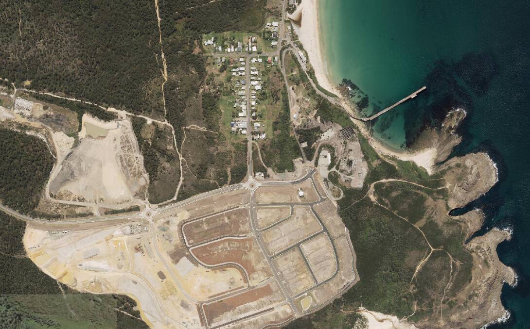 PLANS: An aerial view of the Catherine Hill Bay 'Beaches' estate before housing construction. The proximity of the lagoon can be seen at top. Picture: Six Maps