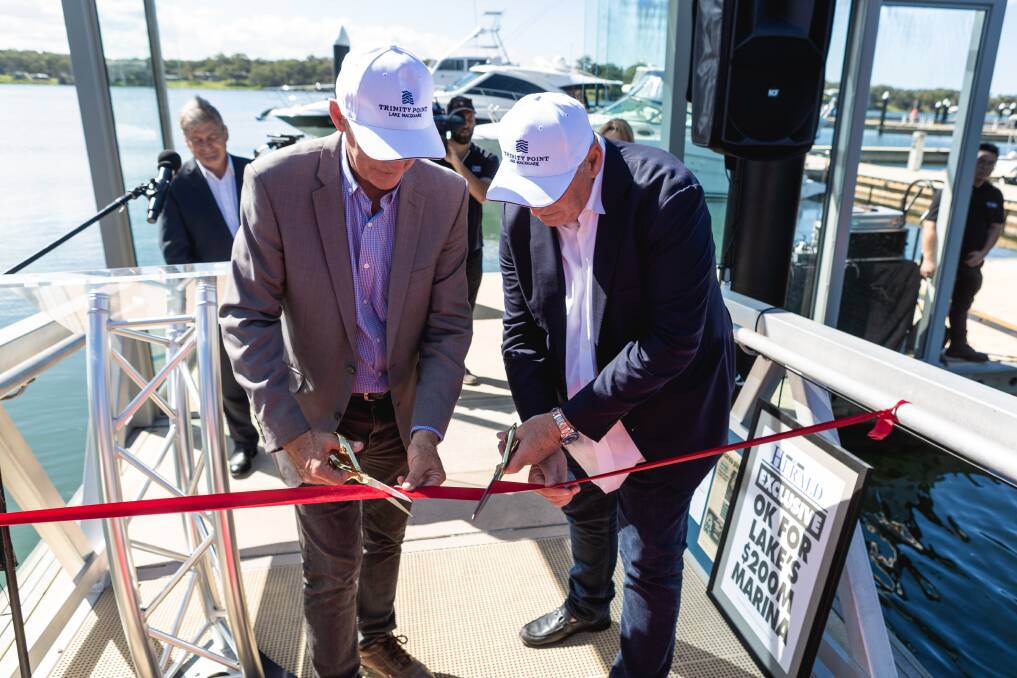 OFFICIAL: Lake Macquarie MP Greg Piper and property developer Keith Johnson cut a ribbon at an opening ceremony on the entrance to the marina. 