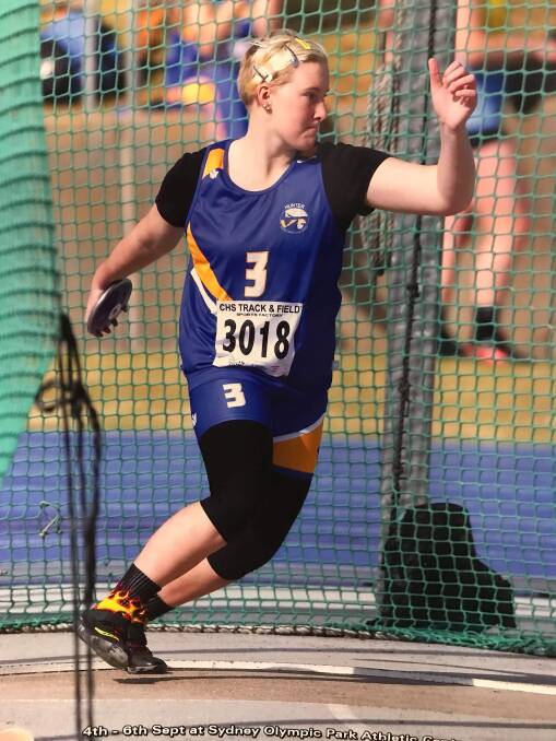 RECORD BREAKER: Ashlyn Blackstock competing in the 15 years girls discuss at the NSW Combined High Schools Athletics Championships at Olympic Park in Sydney last week.