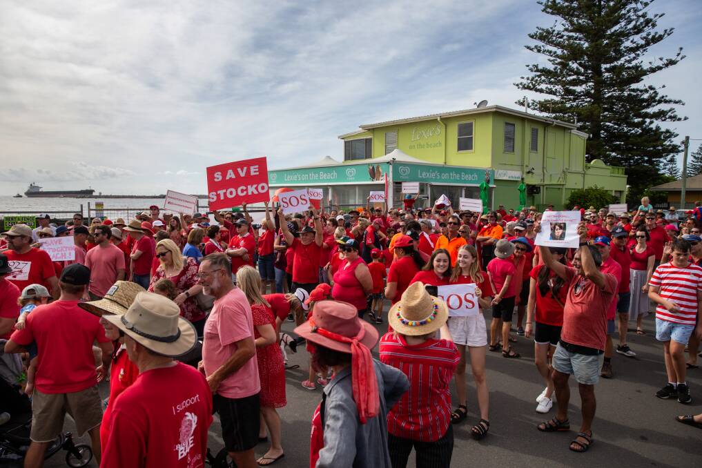 UNITED: The crowd outside the now defunct Lexie's on the Beach cafe in Stockton on Sunday morning. More than 2000 were estimated to have attended. Picture: Marina Neil
