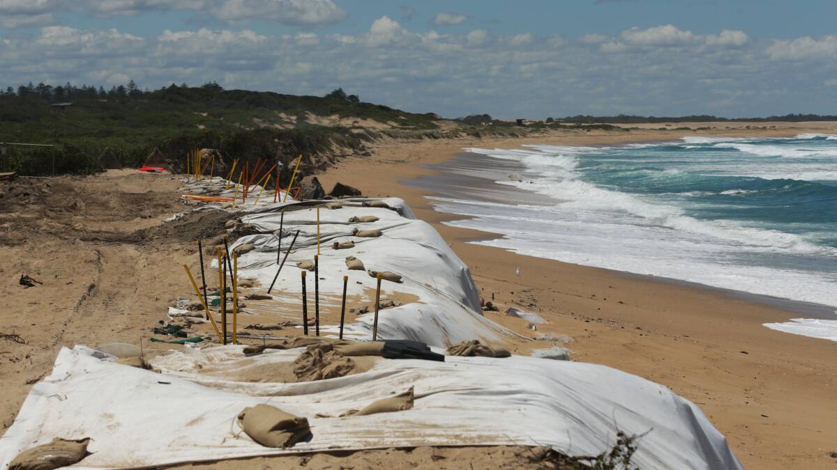 A section of the tip on Stockton beach which was washing out to sea. Picture by Simone De Peak