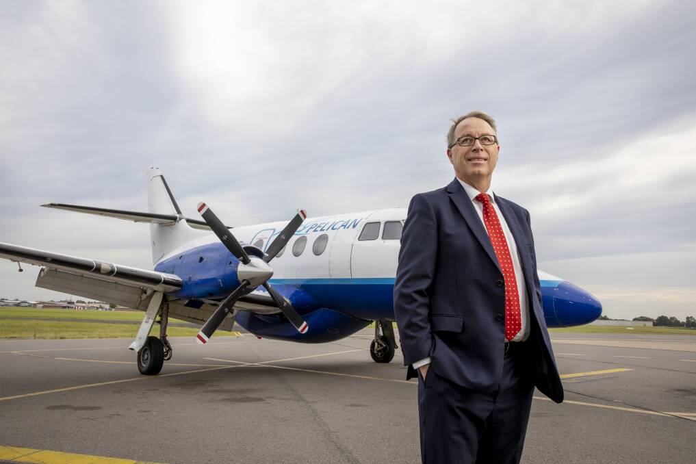 UP AND AWAY: Newcastle Airport CEO Peter Cock alongside a Fly Pelican plane. Picture: Supplied