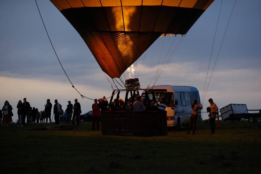 UP AND AWAY: A Balloon Aloft flight about to take off in the Hunter Valley. Picture: Max Mason-Hubers 