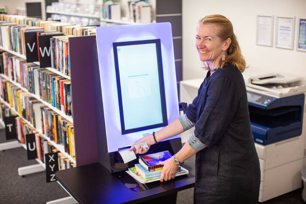 UPGRADE: Learning outreach leader Lauren Boyd at one of the self-serve kiosks. 