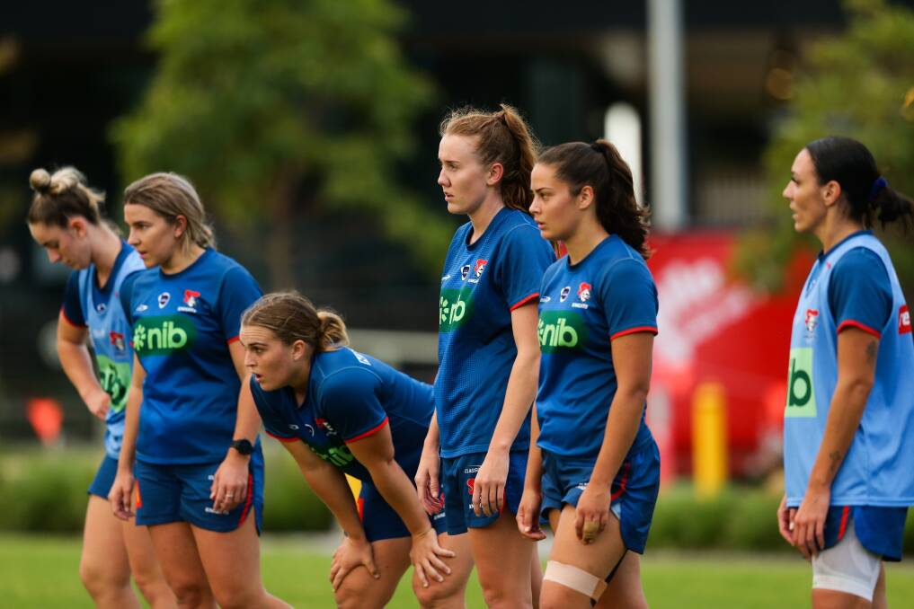 Knights fullback Tamika Upton, second from right, and Jesse Southwell, centre, training with the club's NSW Women's Premiership side. Picture by Jonathan Carroll 