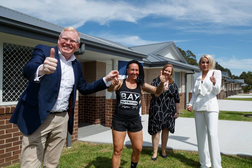 HOUSING BOOST: Minister for Families, Communities and Disability Services Gareth Ward handing a set of keys to Trudy Wood on Wednesday. Picture: Max Mason-Hubers 