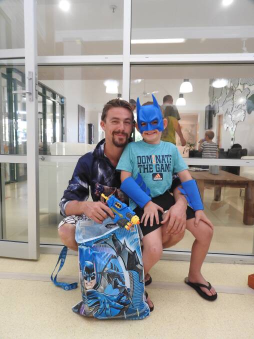 BATMAN: Fabian Hoad and Riley Payne (5) at Newcastle's Ronald McDonald House on Wednesday. Kids received tickets and showbags from Newcastle Regional Show. 