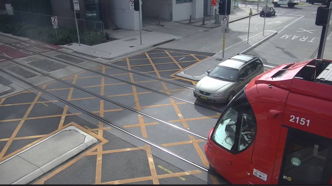 NEAR MISS: A car drives in front of an oncoming tram in Steel Street. View the 'Spike the Rhino' video advertisement at newcastleherald.com.au. Picture: Keolis Downer