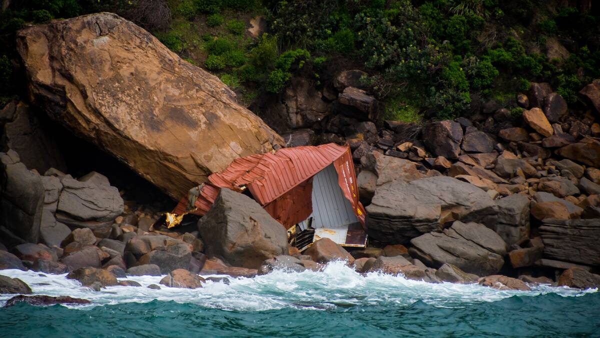 SMASHED: Scenes of debris from the YM Efficiency carrier scattered along the Boulder Bay and Yacaaba Headland in Port Stephens. Picture: Simon McCarthy