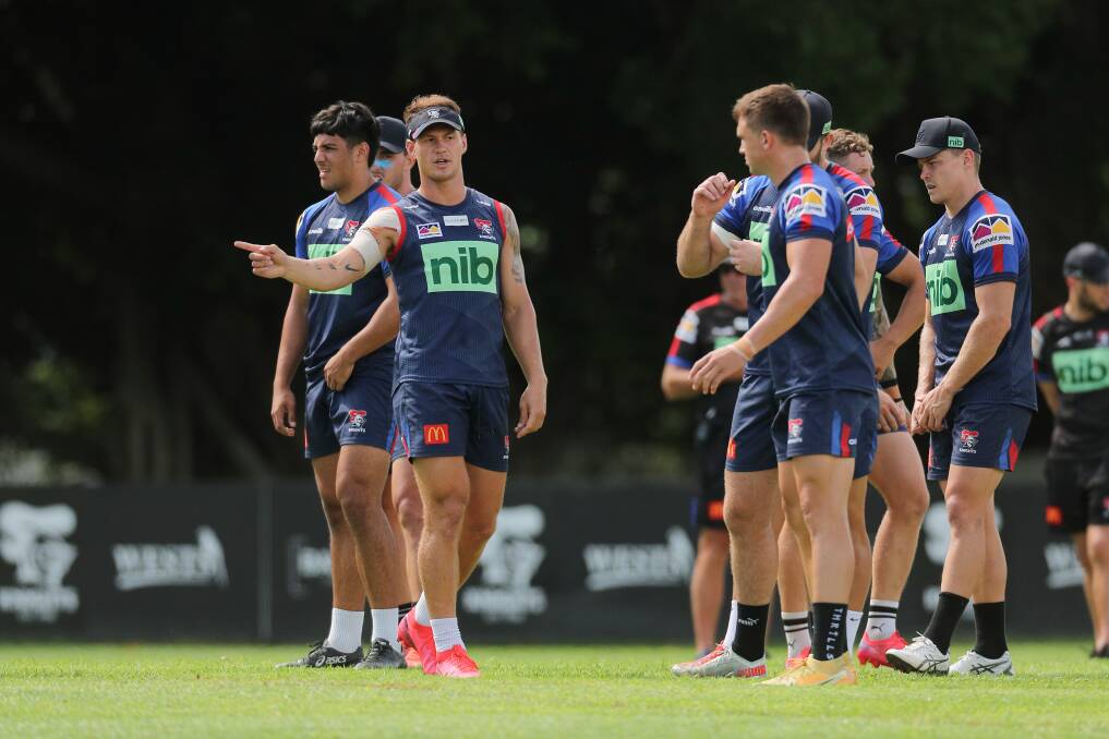 LEADER: Kalyn Ponga, left, talking to Knights hooker Chris Randall, right, during pre-season training. Picture: Max Mason-Hubers 