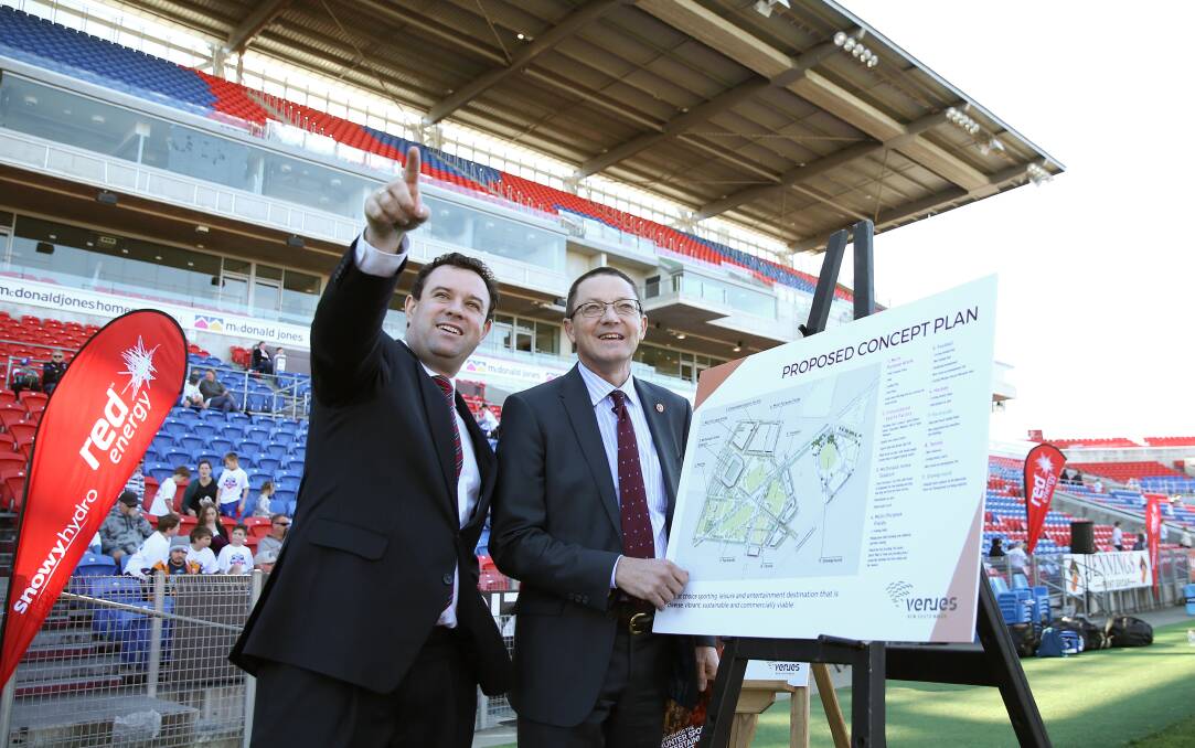 BRIGHT EYED: Sports Minister Stuart Ayres with Scot MacDonald at McDonald Jones Stadium announcing the Broadmeadow concept plan in July, 2017. Picture: Marina Neil